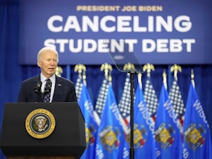 caption: President Biden speaks at an event about canceling student debt, at the Madison Area Technical College Truax campus, April 8, 2024, in Madison, Wis.
