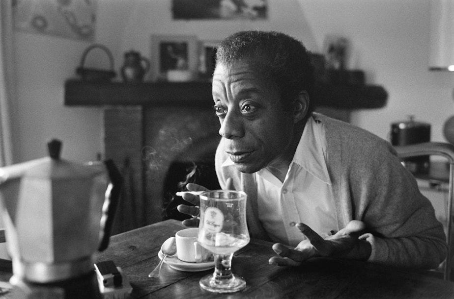 caption: American novelist, writer, playwright, poet, essayist and civil rights activist James Baldwin poses at his home in Saint-Paul-de-Vence, southern France, on November 6, 1979. (RALPH GATTI/AFP via Getty Images)