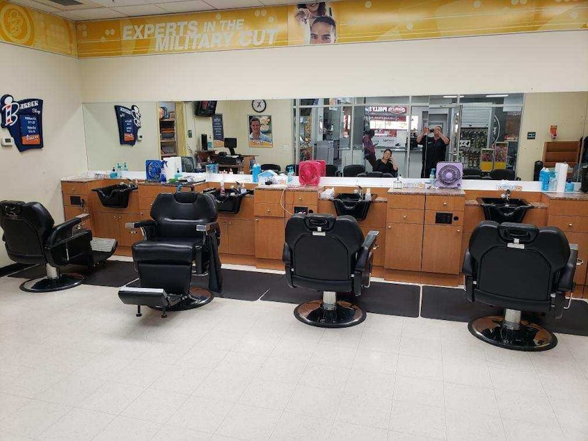 caption: The North Fort barbershop at Joint Base Lewis-McChord is one of three union shops. In one day, a barber can serve 20 to 30 customers. 