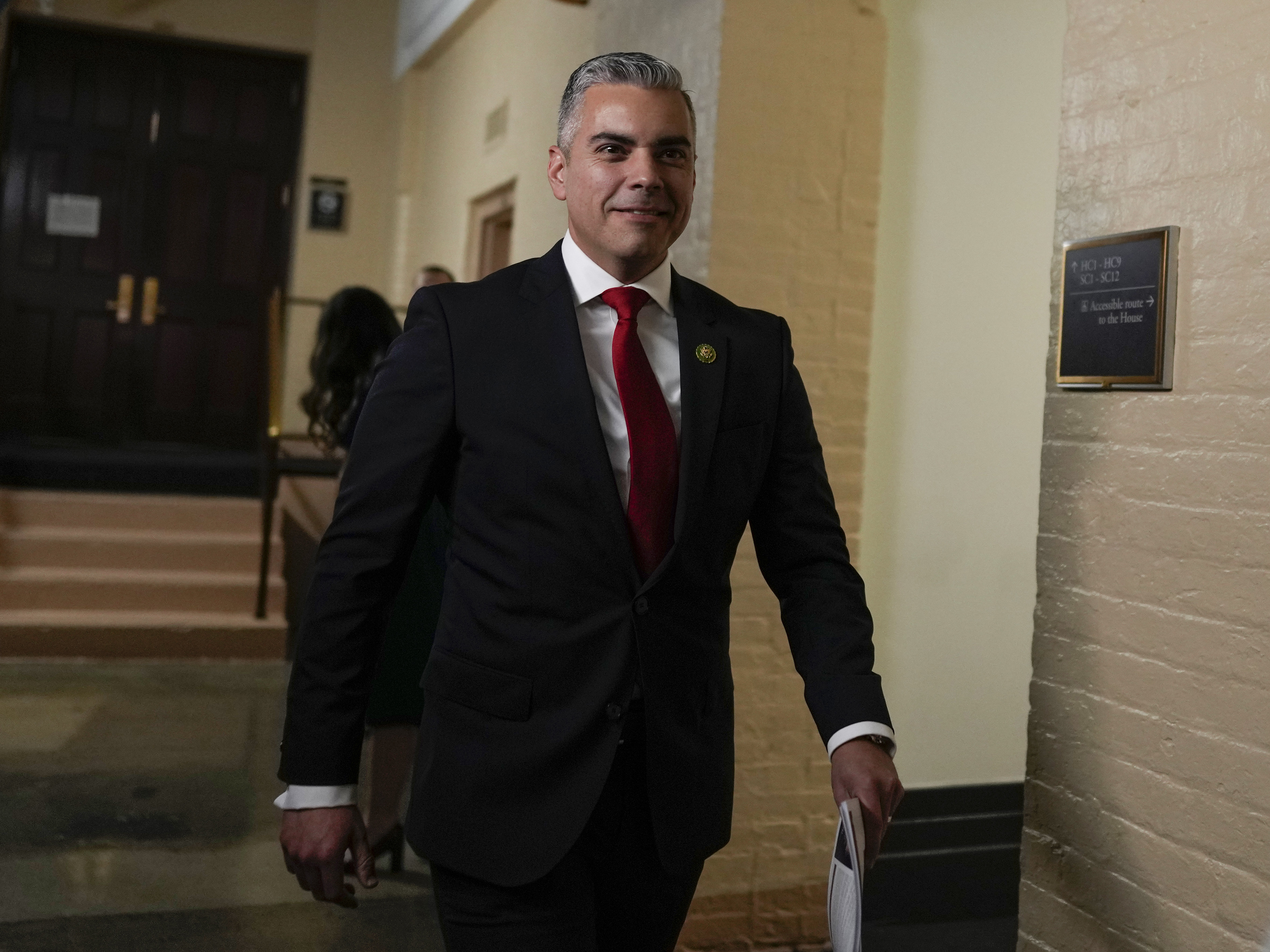 caption: Rep. Juan Ciscomani, R-Ariz., walks past reporters on the opening day of the 118th Congress at the U.S. Capitol in Washington on Jan. 3.