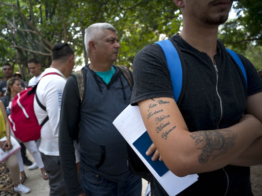 caption: Cubans wait their turn to enter Panama's embassy to apply for travel visas to Panama, in Havana, last March. The U.S. State Department eliminated a coveted five-year tourist visa for Cubans, dealing a heavy blow to entrepreneurs and Cuban members of divided families, who used the visas to see relatives in the U.S. and buy precious supplies for their businesses on the island.