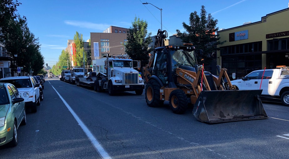 caption: The city of Seattle staged vehicles outside the CHOP Friday morning before an attempt to remove road barriers.