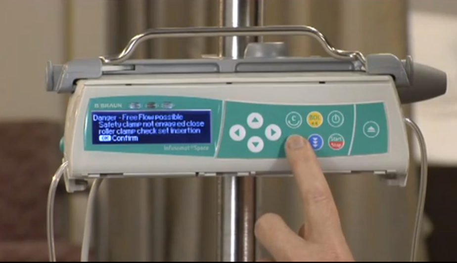 caption: A screenshot from an Infusomat training video warns of the danger of a "free flow" of drugs pouring from the machine if loaded improperly.