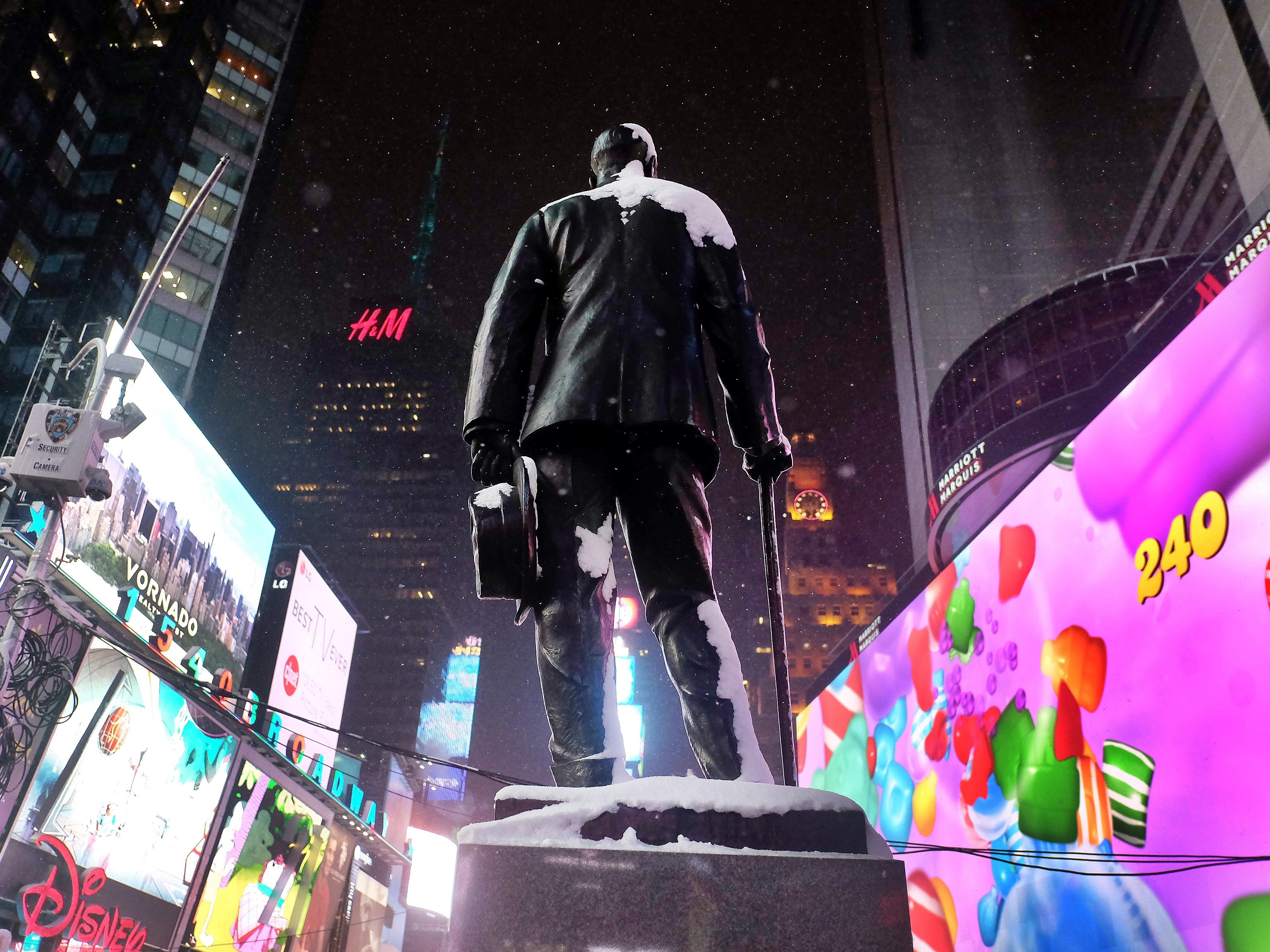 caption: A statue of George M. Cohan, prolific Broadway composer and performer, stands in New York's Times Square.