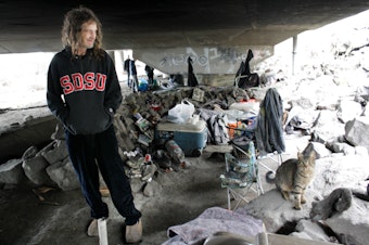 caption: Many cats and dogs live as pets to residents of the Jungle, Seattle's notorious homeless encampment.
