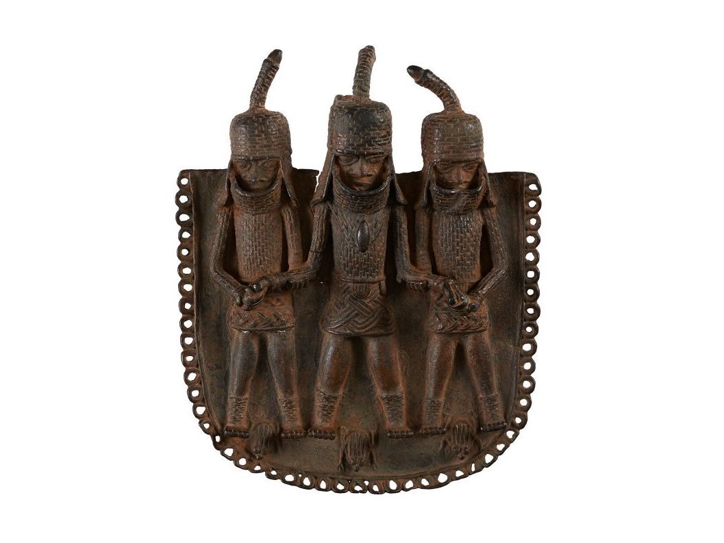 caption: The Horniman Museum's collection of artifacts from the ancient kingdom of Benin includes 12 brass plaques, ceremonial objects and a key 'to the king's palace'.