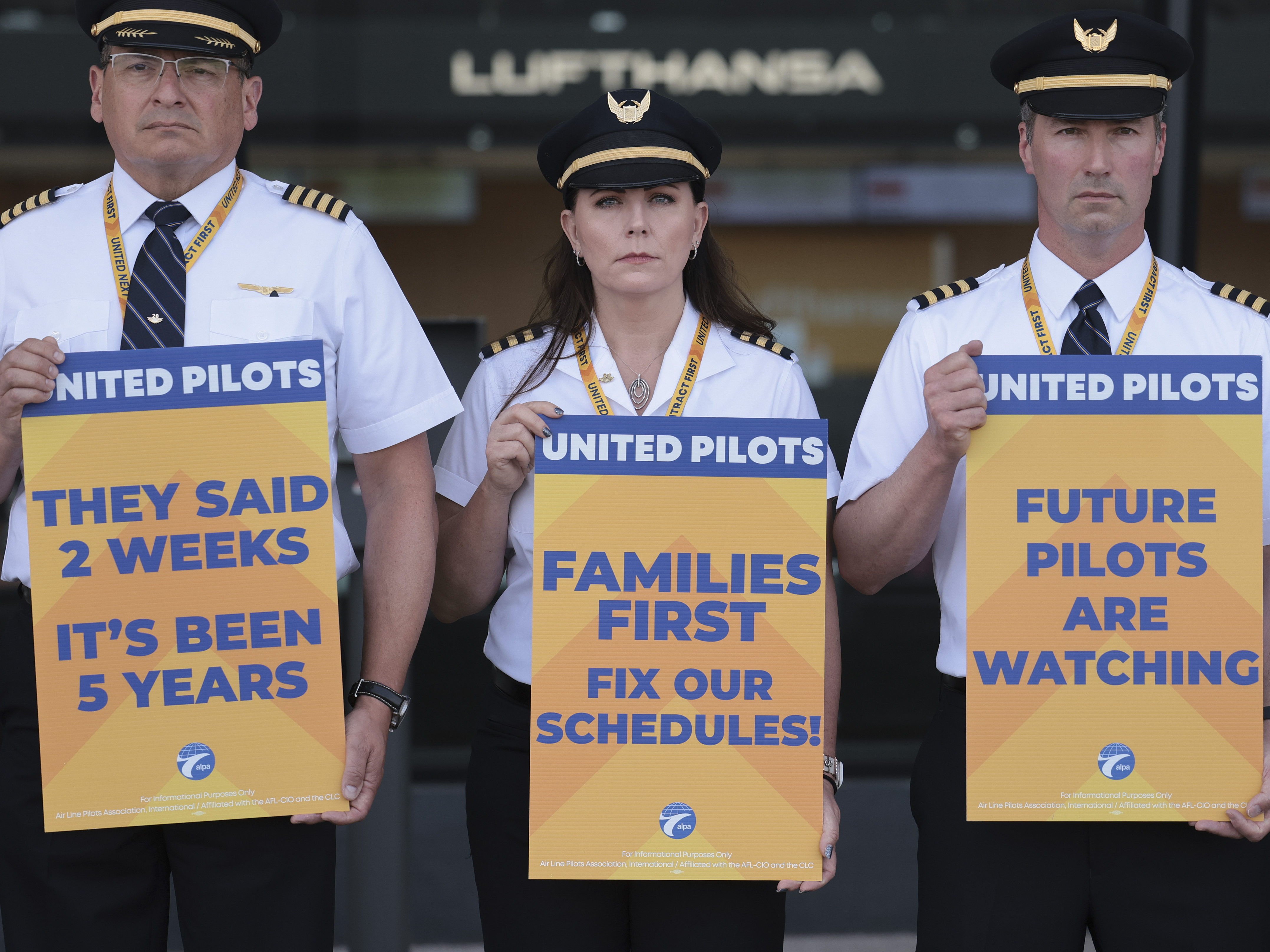 caption: United Airlines pilots participate in a picket line at Washington Dulles International Airport on May 12, 2023. Ahead of a busy summer travel season, they're asking for higher wages and also quality of life improvements.