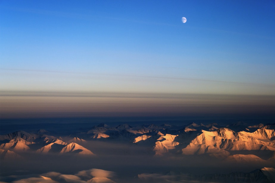 caption: The moon over northeast Greenland during in March 2014 when a team of scientists were conducting an aerial survey of polar ice.