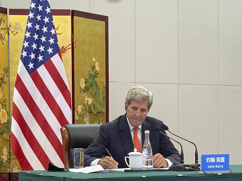 caption: In this photo provided by the U.S. Department of State, U.S. Special Presidential Envoy for Climate John Kerry attends a meeting with Chinese Foreign Minister Wang Yi via video link in Tianjin, China, Wednesday, Sept. 1, 2021. Wang warned Kerry on Wednesday that deteriorating U.S.-China relations could undermine cooperation between the two on climate change.