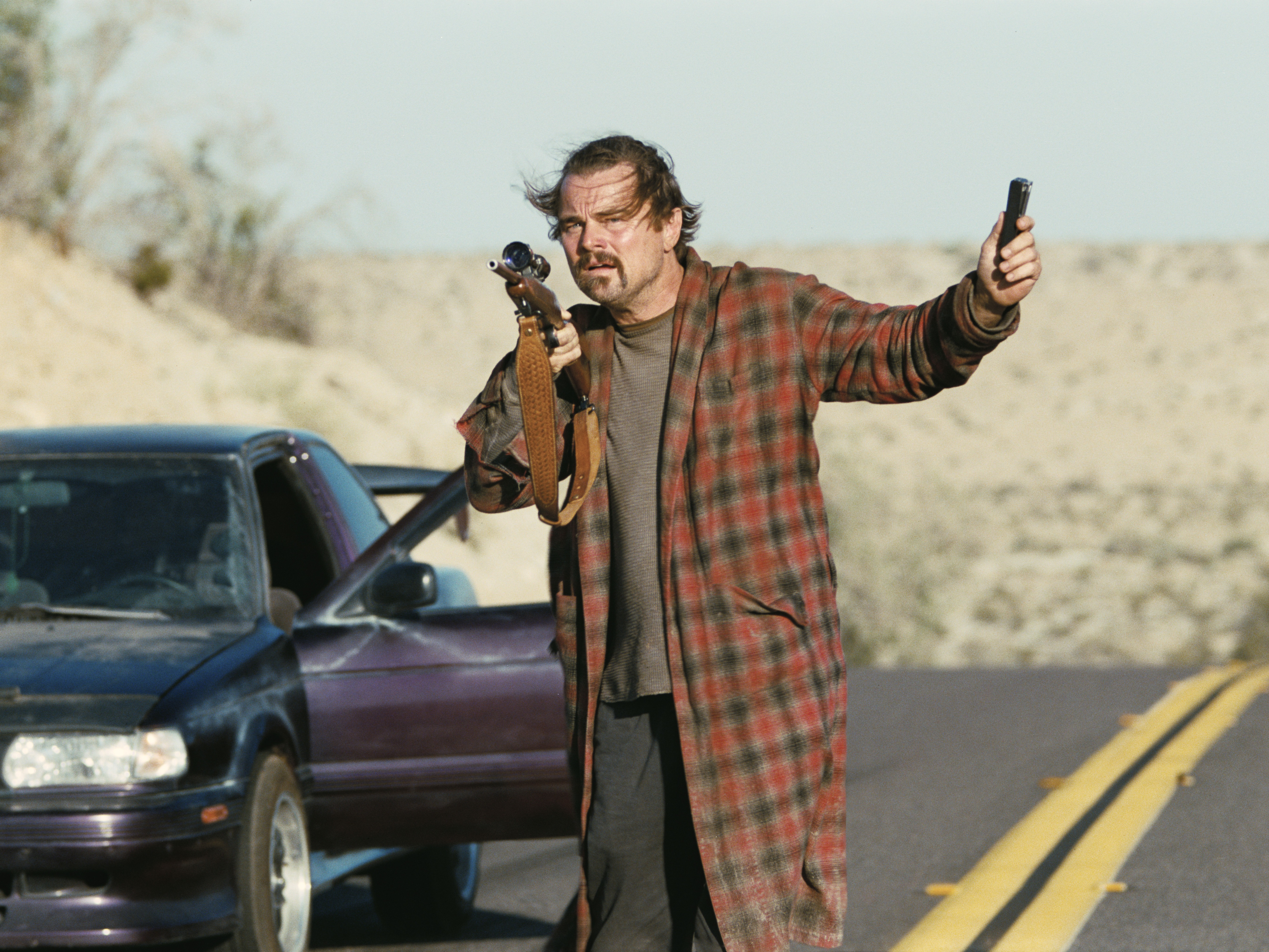 caption: Leonardo DiCaprio plays a former political militant who's gone into hiding in <em>One Battle After Another.</em>