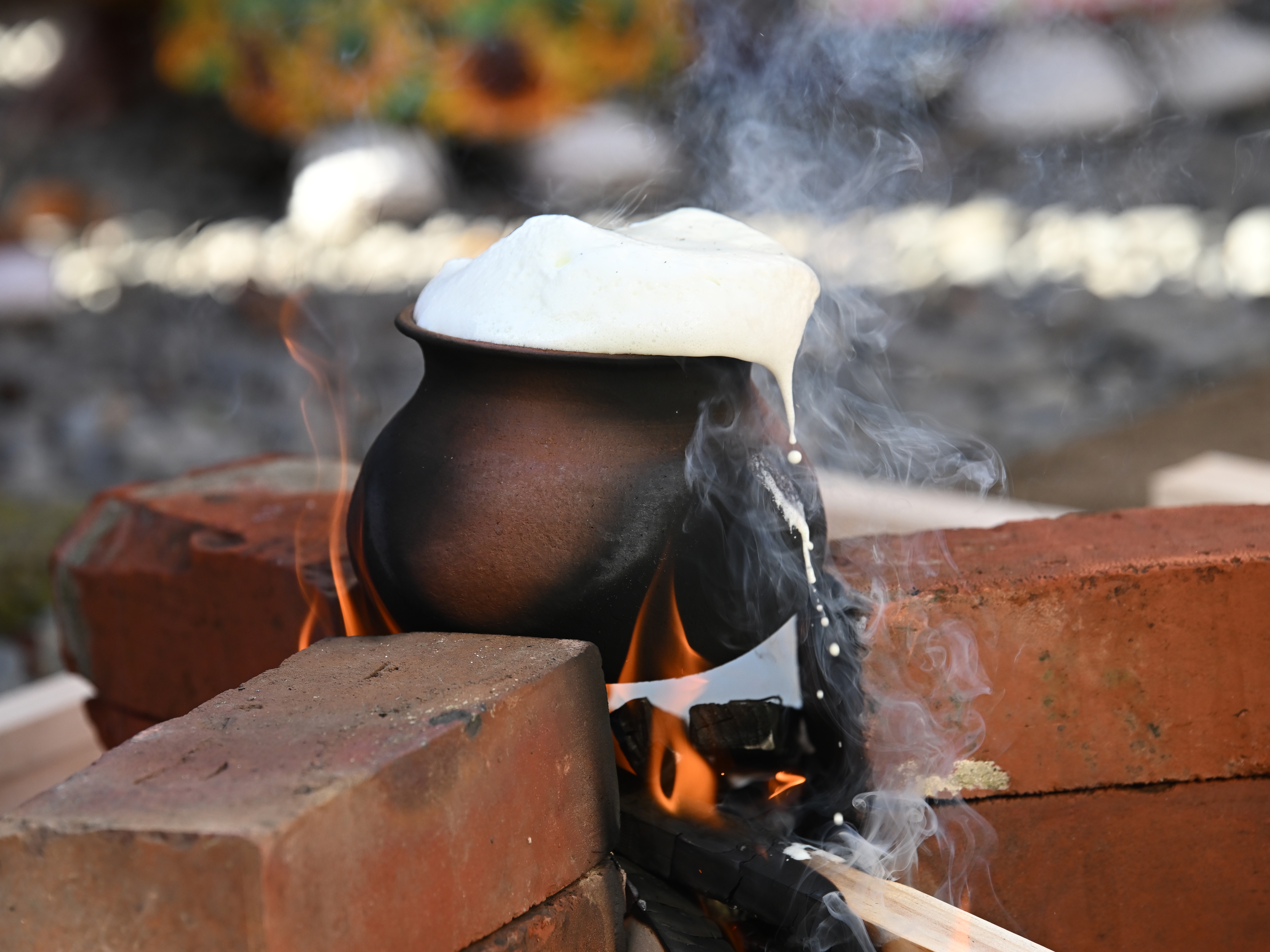 caption: A New Year began on April 14 for Sri Lankan Buddhists and Hindus. One custom is to boil fresh milk in a new clay pot and allow it to overflow, seen as a way of invoking blessings.
