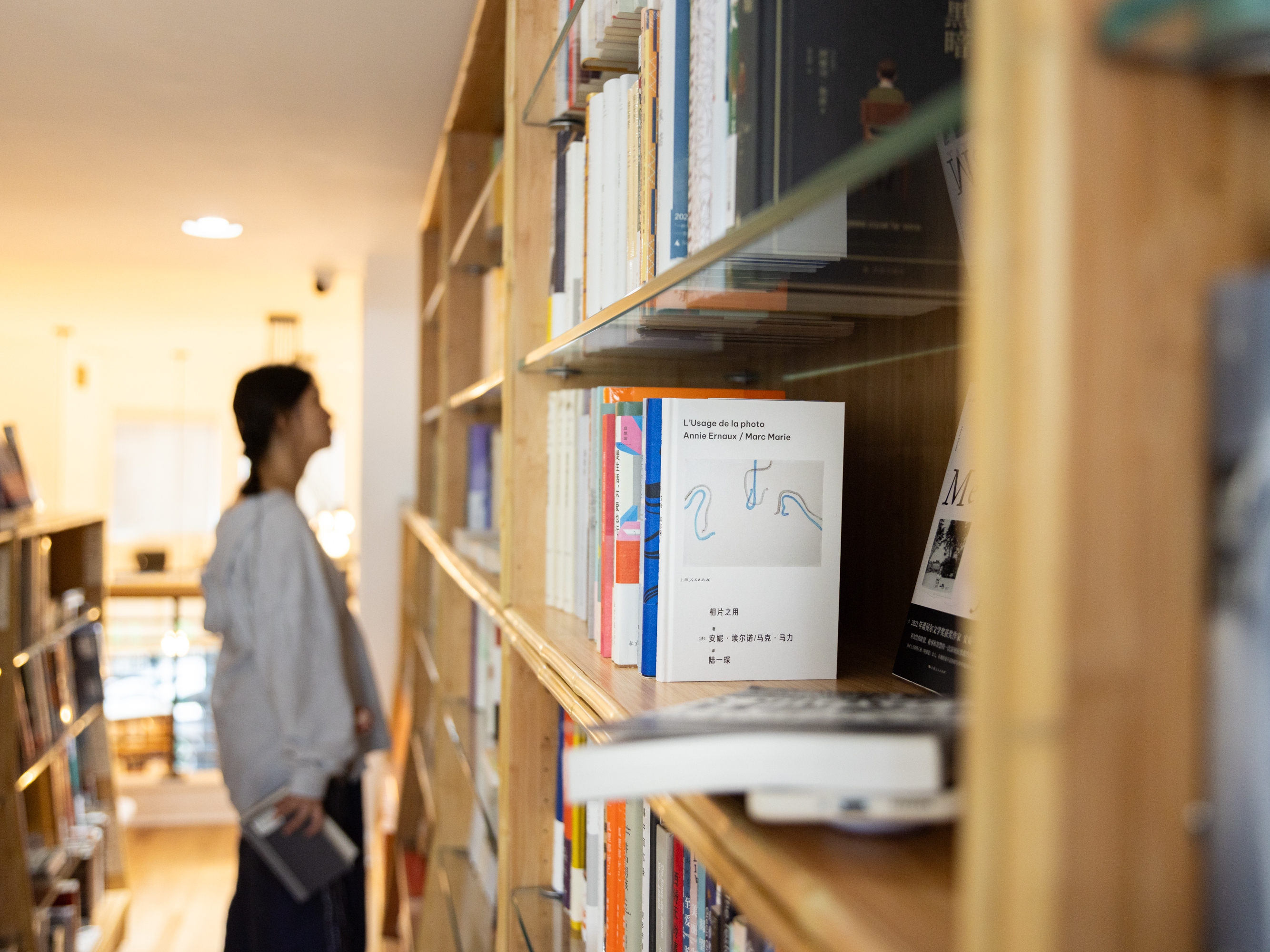 caption: A customer browses titles at JF Books on September 17, 2024.