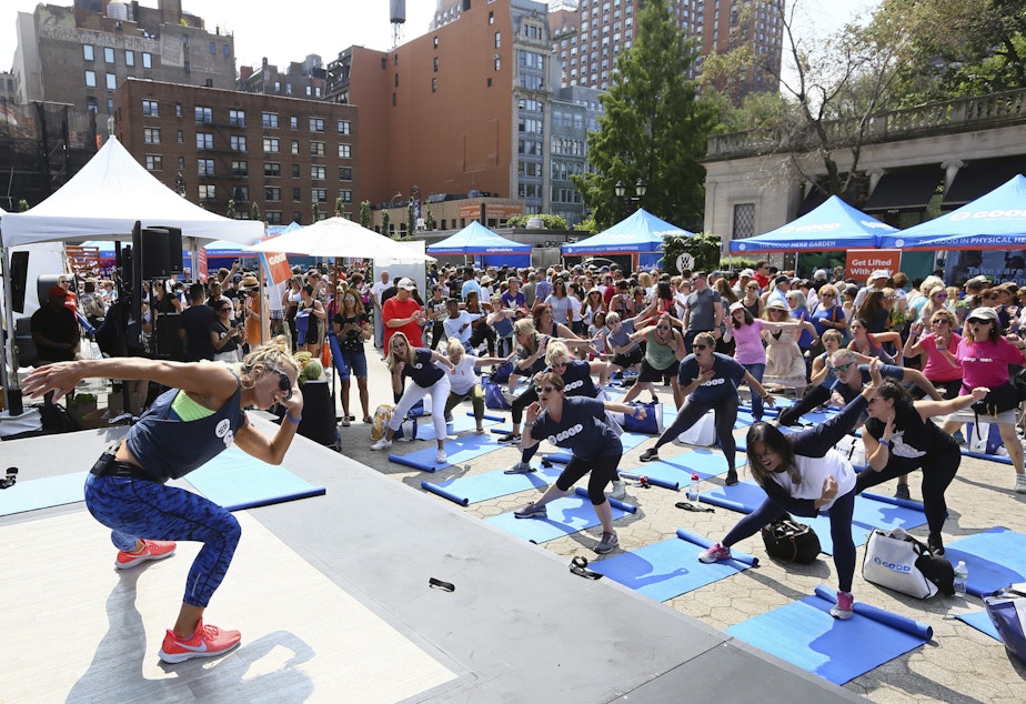 At a WW GOOD wellness festival powered by Weight Watchers “WW” in Union Square, New York City residents engage in a movement and meditation series (“LIFTED”) led by Celebrity Fitness Instructor Holly Rilinger, Sunday, August 26, 2018. (Stuart Ramson/Weight Watchers via AP Images)