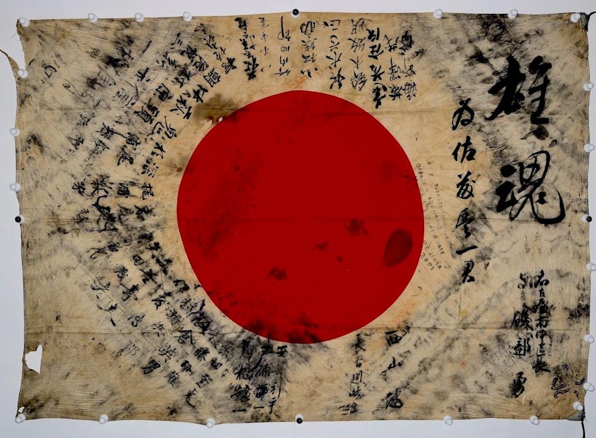caption: A Portland man who inherited this inscribed flag transferred it back to relatives of the fallen Japanese soldier who carried it into battle in WWII.