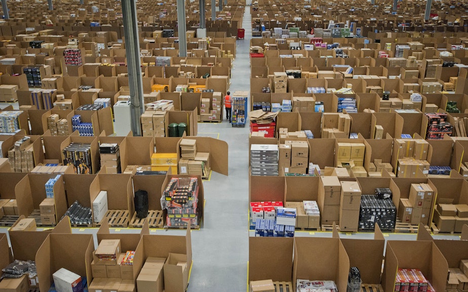 caption: Retail giant Amazon is raising its minimum wage to more than double the federal wage.