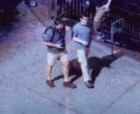 caption: FBI Surveillance photo of Michael Zottoli (right) and Richard Murphy (left) at Columbus Circle, New York in 2004. Both were members of 'Operation Ghost Stories.' Michael and his wife Patricia Mills were stationed in Seattle in the early 2000s.  
