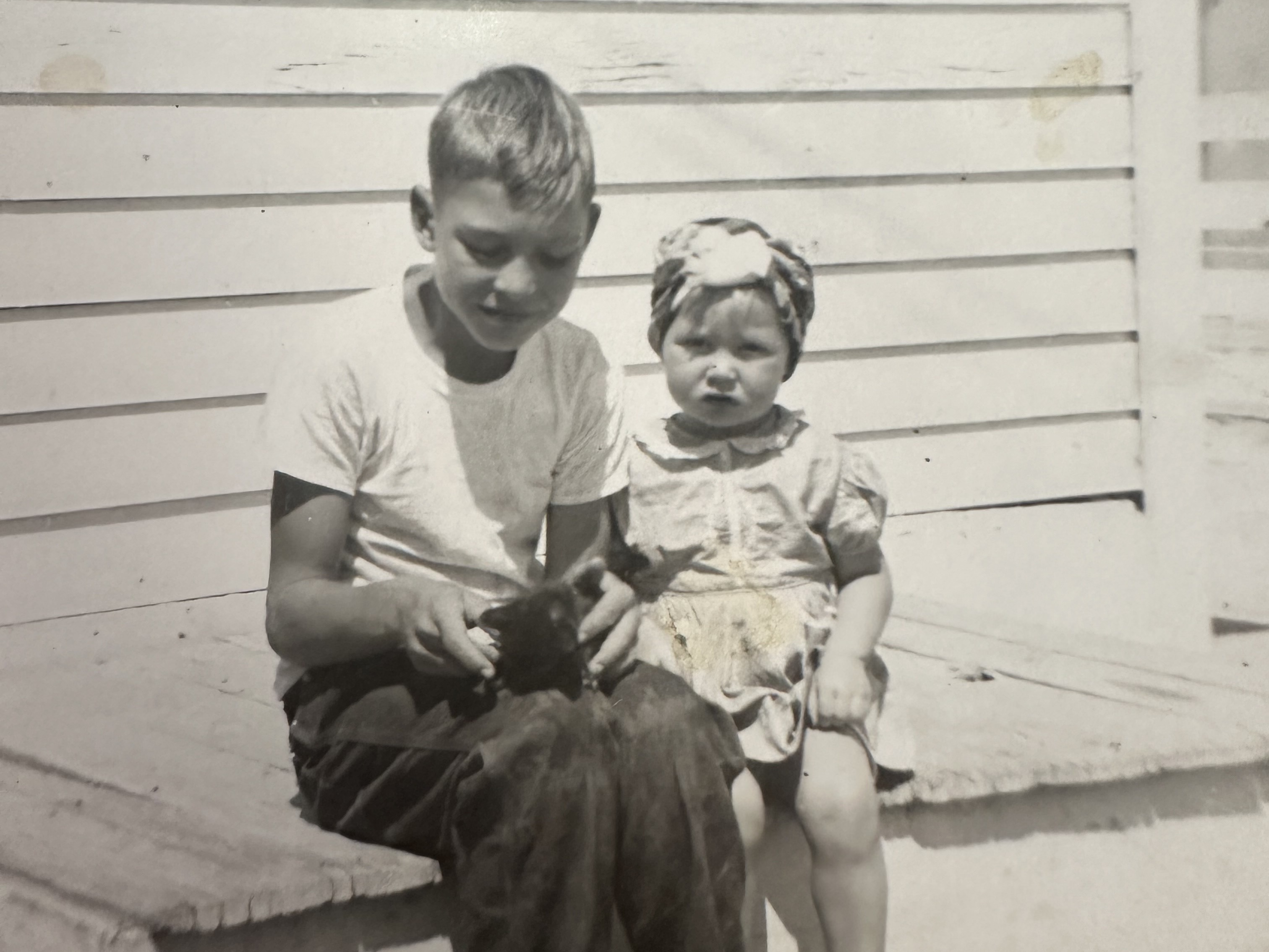 caption: Pat Rush (right) with her brother in Arkansas circa late 1930s.