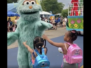 caption: A video showing two Black girls reaching out to the Sesame Street character Rosita and not being acknowledged has resulted in allegations of racism at Sesame Place Philadelphia.