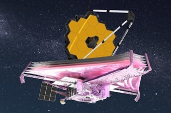 caption: An artist's rendition of the James Webb Space Telescope with its sunshield deployed.
