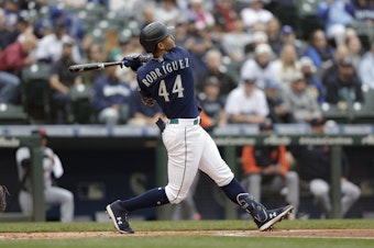 caption: Seattle Mariners' Julio Rodriguez swings through after hitting a solo home run on a pitch from Detroit Tigers starting pitcher Tyler Alexander during the first inning of a baseball game, Wednesday, Oct. 5, 2022, in Seattle.