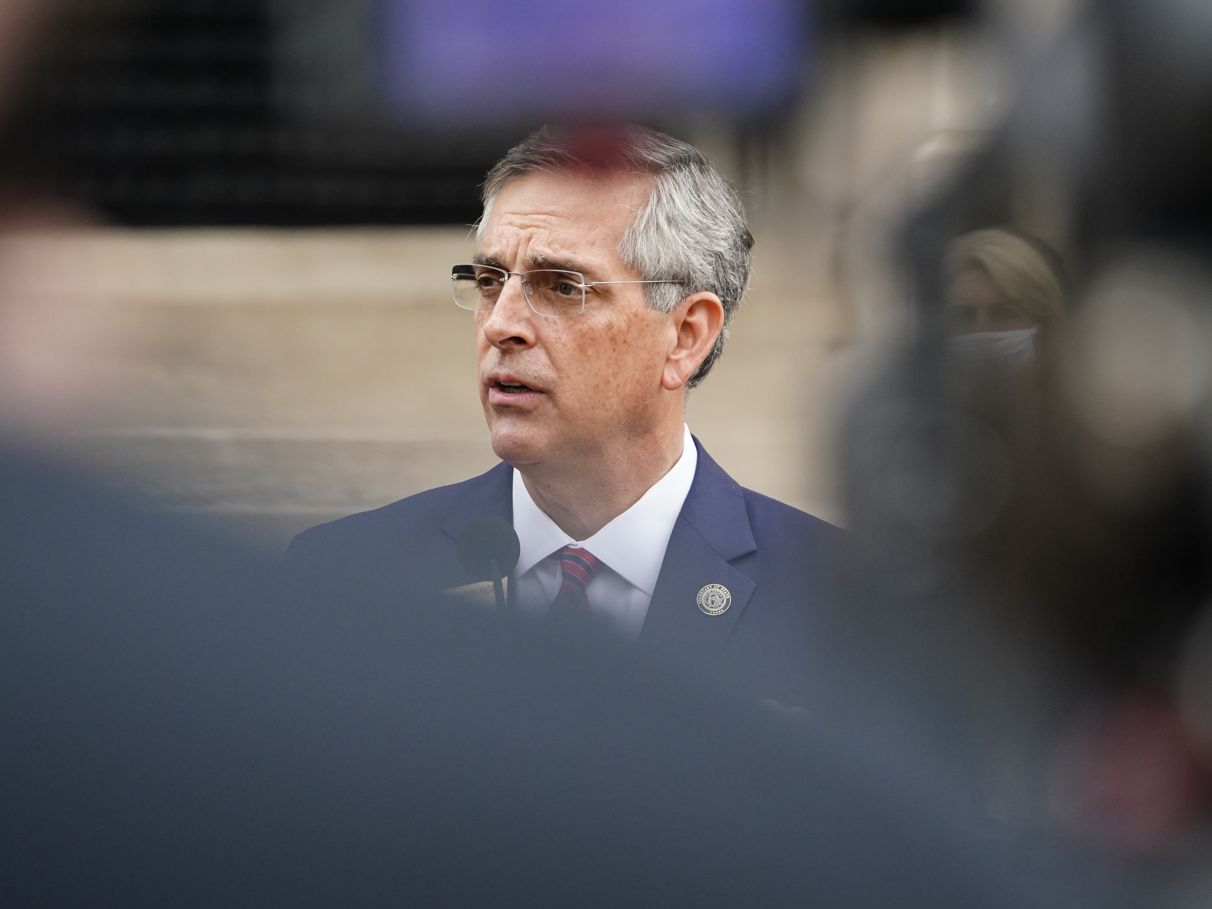 caption: Georgia Secretary of State Brad Raffensperger won wide praise for firmly rejecting former President Donald Trump's false claims of voter fraud. But now that those claims have spawned tighter voting measures, the Republican state official is taking a softer approach.