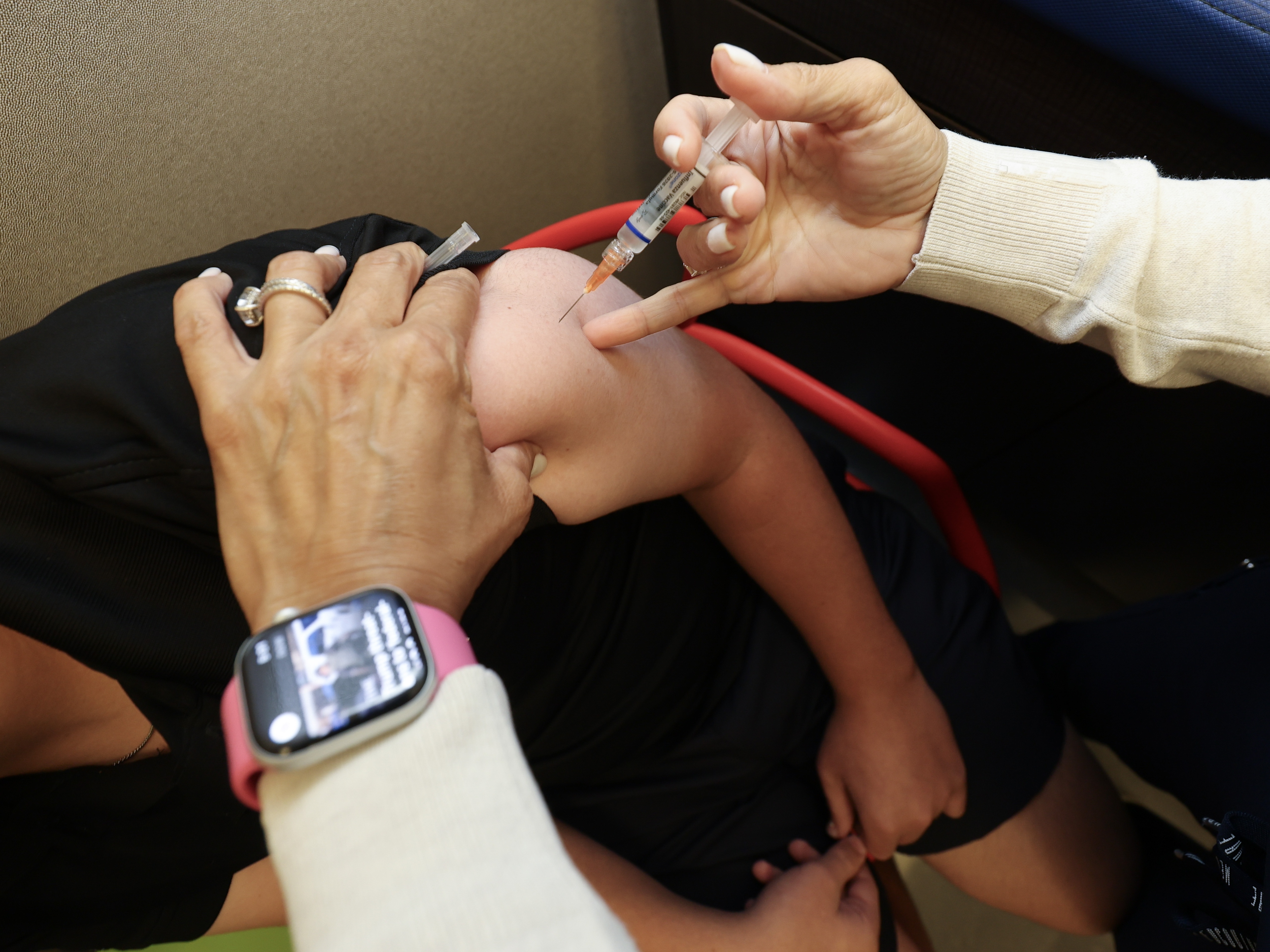 caption: The Centers for Disease Control and Prevention has developed a new vaccine schedule that would reduce the number of routine vaccinations for all kids.