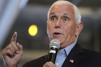 caption: Republican presidential candidate former Vice President Mike Pence speaks at the Northside Conservatives Club Meeting, on August 30 in Iowa.