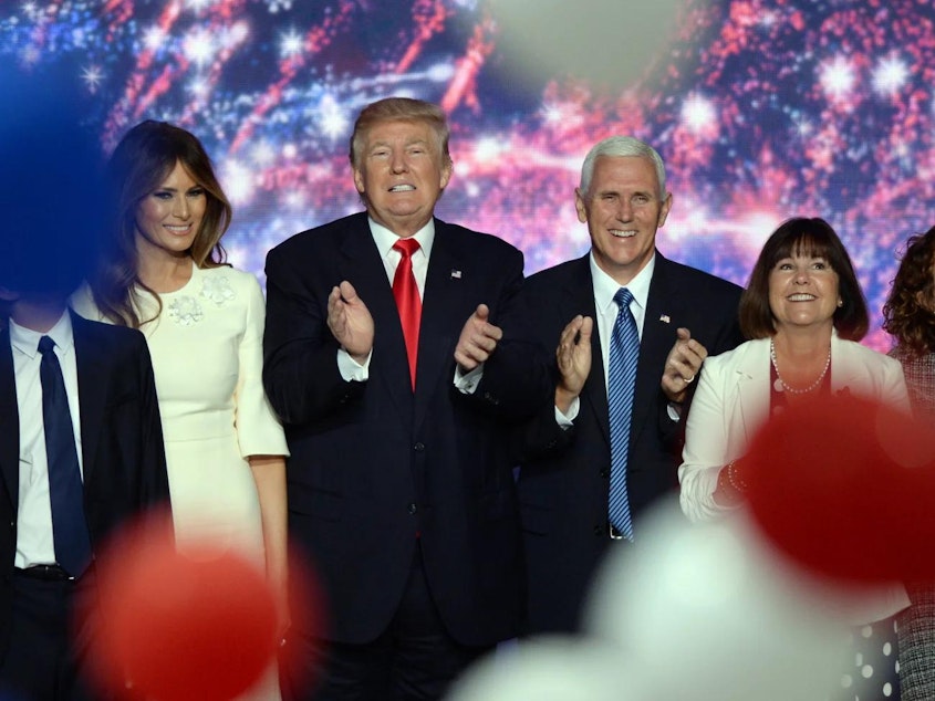 caption: In 2016, Republican presidential nominee Donald Trump, left, and his running mate Indiana Gov. Mike Pence, celebrate after accepting the Republican nomination for president at the Republican National Convention in Cleveland.
