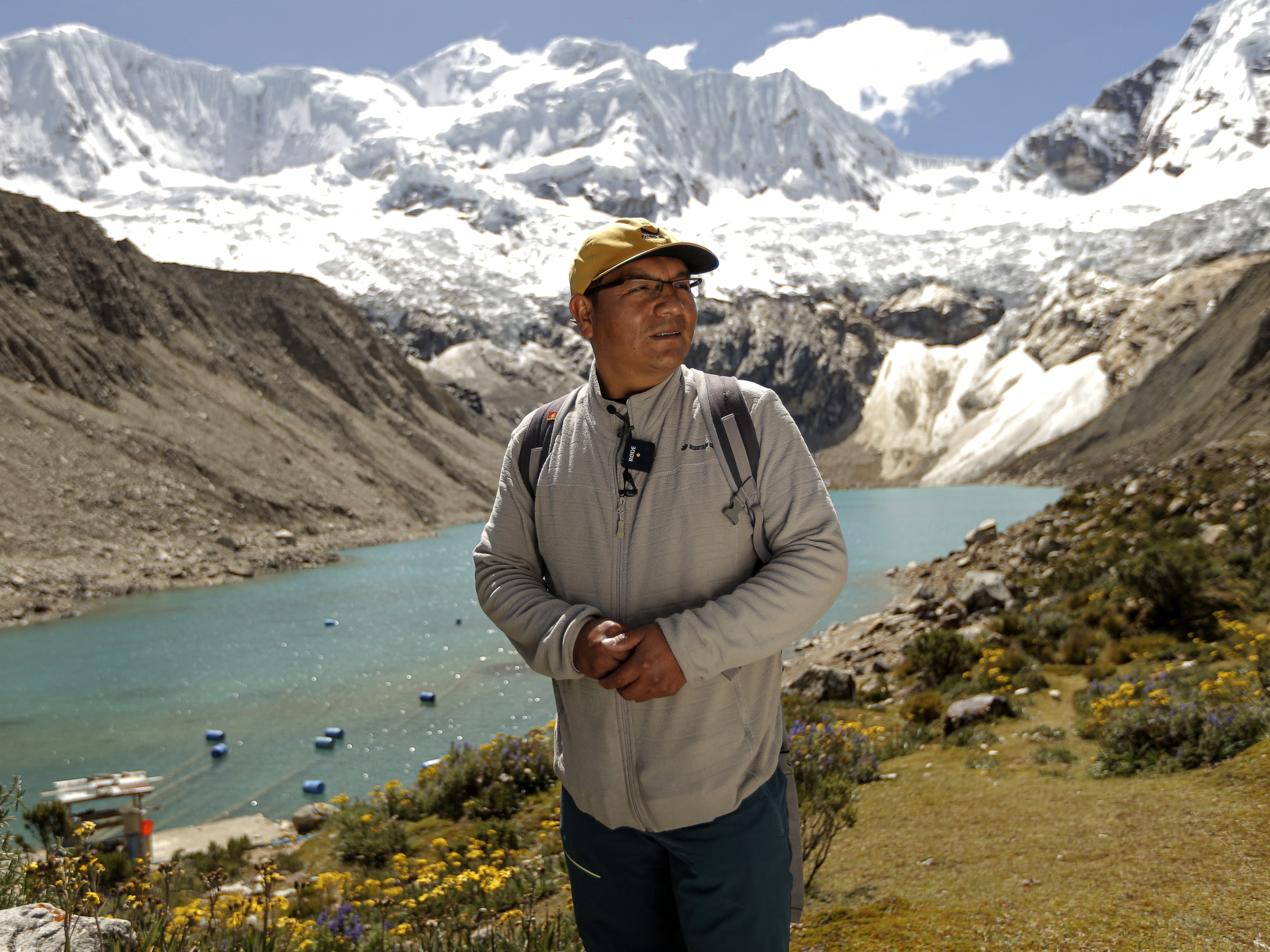 caption: Saul Luciano Lliuya in front of Lake Palcacocha, located at 4,650 meters above sea level at the Huascaran National Park, in Huaraz, northeastern Peru, on May 23, 2022.