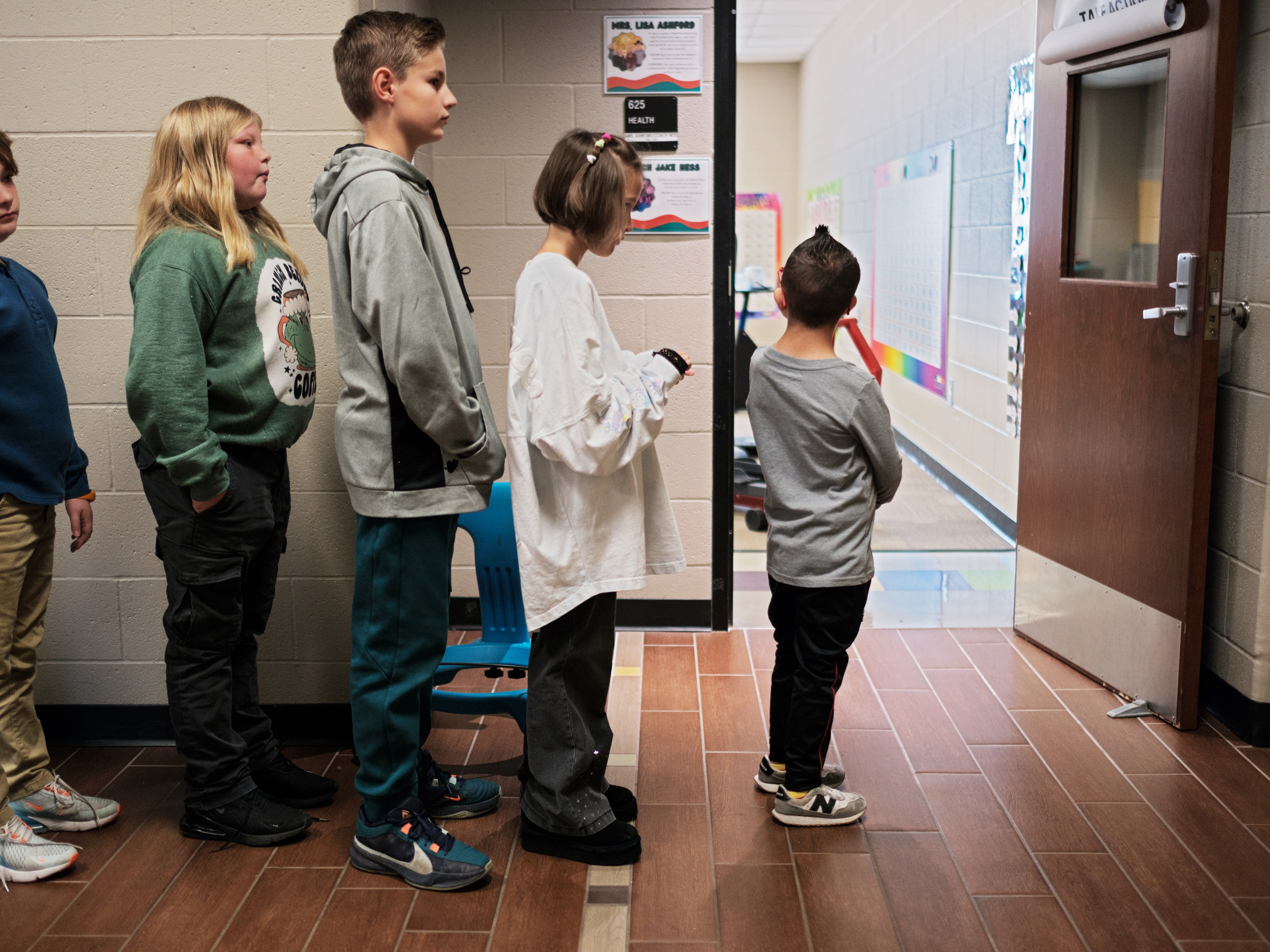 caption: Kellen Hedler leads his fellow classmates at Frontier Elementary School near Oklahoma City. Kellen has Down syndrome, a genetic condition that causes a range of physical and developmental challenges.