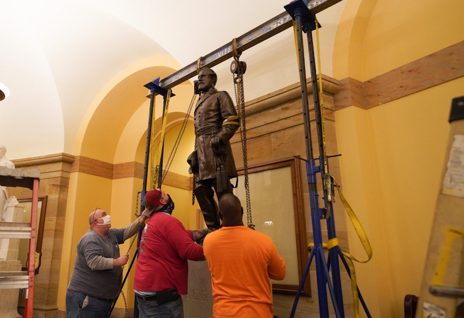 caption: A statue of Robert E. Lee was removed from the U.S. Capitol early Monday.
