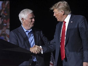 caption: Former President Donald Trump welcomes Rep. Mo Brooks, R-Ala., a candidate for U.S. Senate, to the stage during a rally in Cullman, Ala., on Aug. 21, 2021. Trump on Wednesday pulled his endorsement of Brooks, who's been struggling in polls.