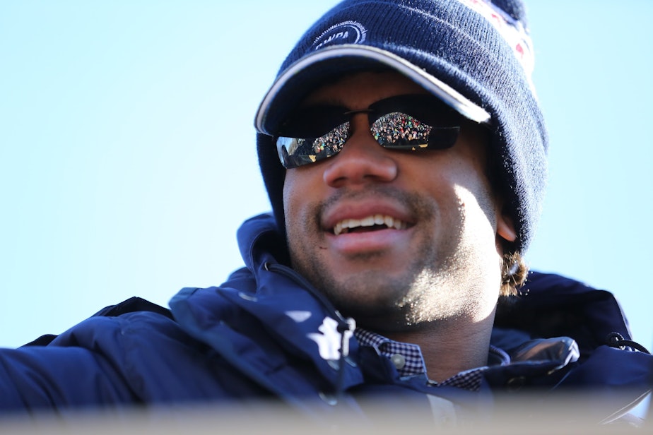 caption: Russell Wilson in downtown Seattle after the Seahawks won the Super Bowl in 2014.
