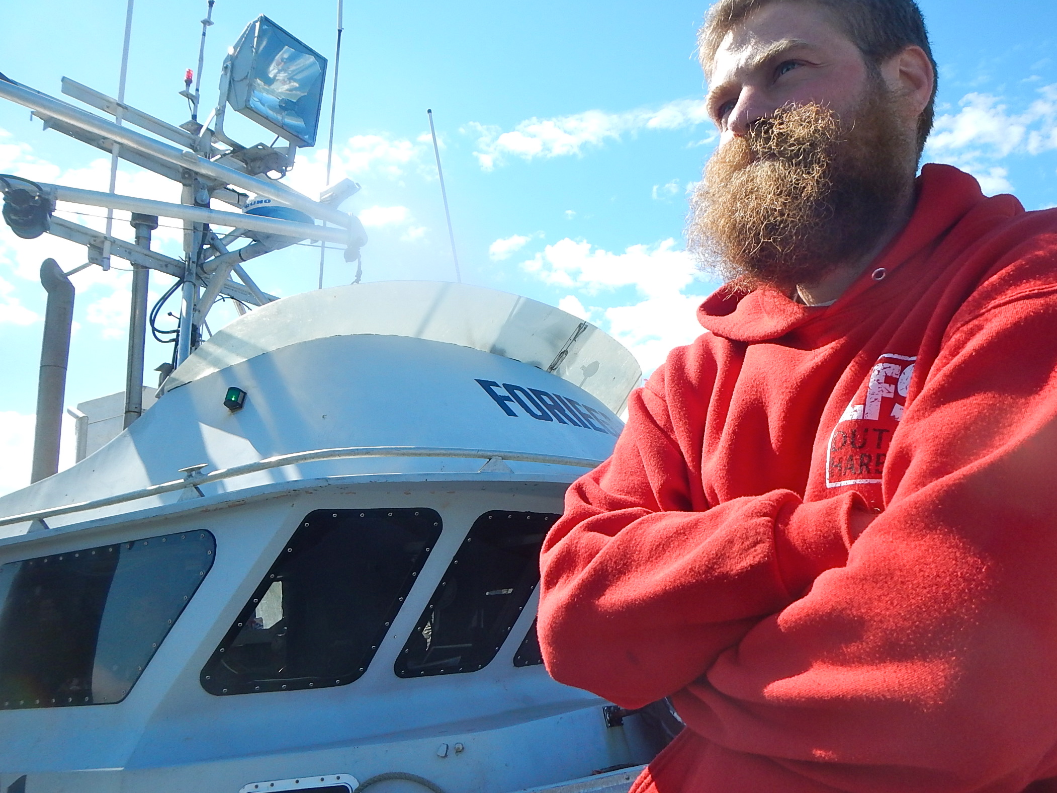 caption: Mihey Basargin of Wasilla on the docks in Dutch Harbor after being rescued. 