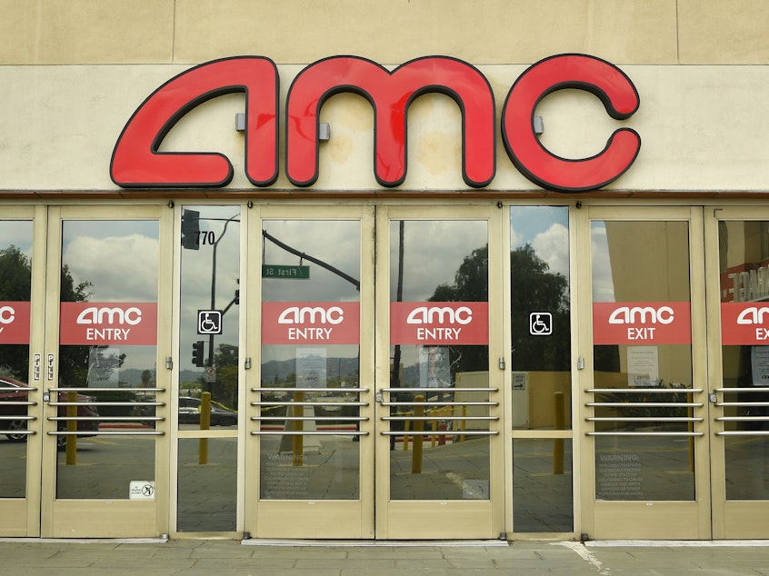 caption: Later feature film releases have pushed AMC Theatres to delay its phased reopening until July 30.