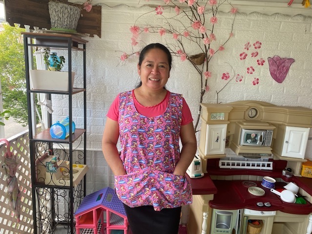 caption: Damaris Mejia runs a child care center out of her Washington, D.C., rowhouse. In an effort to stem a shortage of early educators, the city wants to boost their pay closer to that of public school teachers.