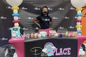 caption: Paris Muhammad, CEO of Paris Place LLC, at the ribbon-cutting ceremony celebrating the moment she made history as the youngest member of the Conyers-Rockdale Chamber of Commerce in Georgia.