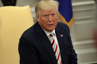 caption: President Trump speaks to reporters in the Oval Office on Tuesday. He said that Russia should be allowed back into the G-7.