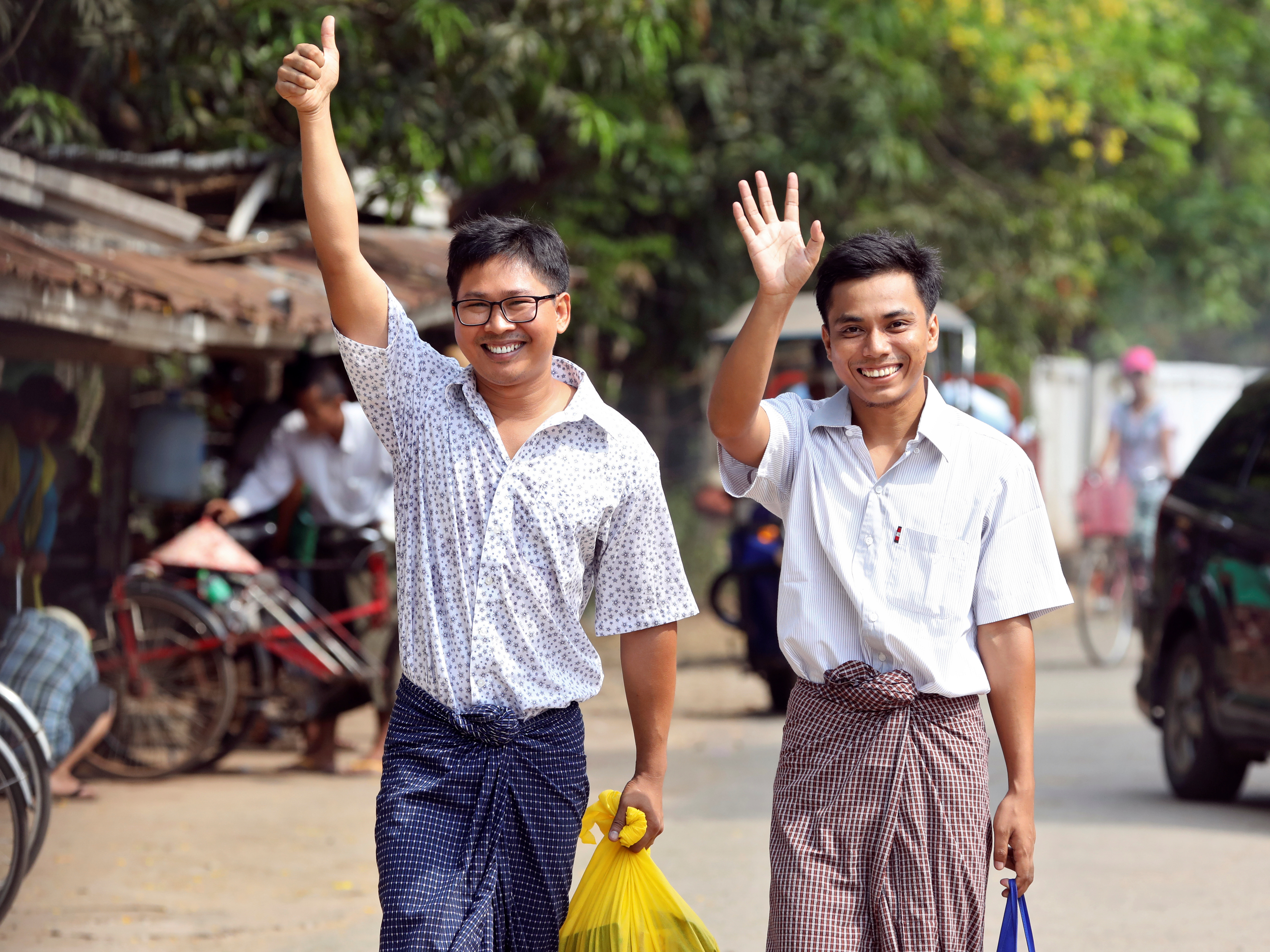 caption: Reuters reporters Wa Lone and Kyaw Soe Oo after being freed from Insein prison, after receiving a presidential pardon in Yangon, Myanmar, on Tuesday.