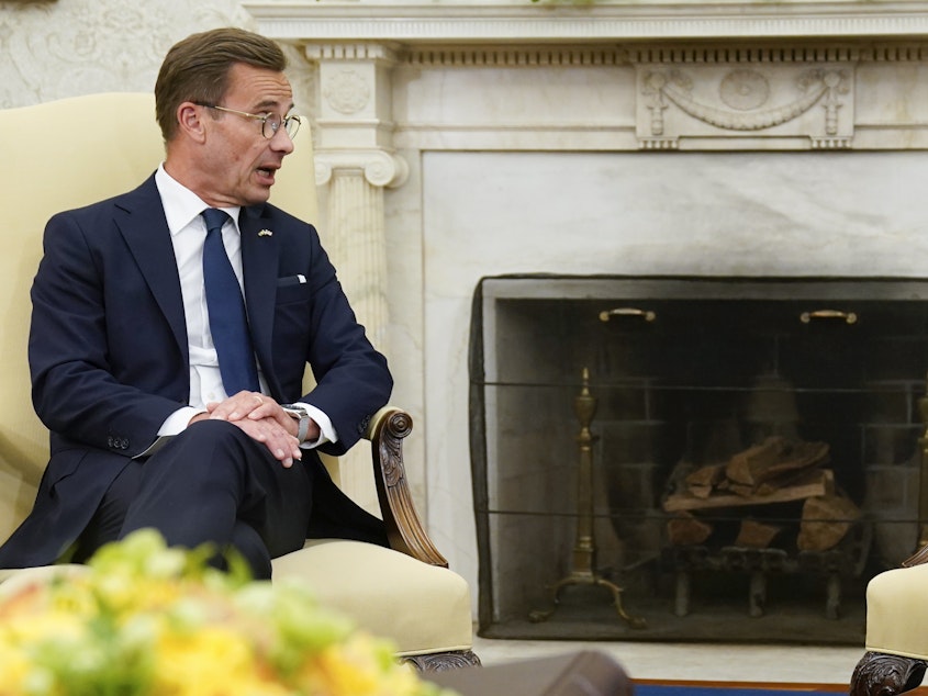 caption: President Biden (right) meets with Swedish Prime Minister Ulf Kristersson in the Oval Office on July 5, 2023, in Washington. Sweden has formally joined NATO as the 32nd member of the transatlantic military alliance.