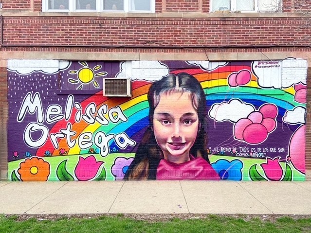 caption: A mural of Melissa Ortega, an 8-year-old victim of gun violence in Chicago, painted by artist Milton Coronado.