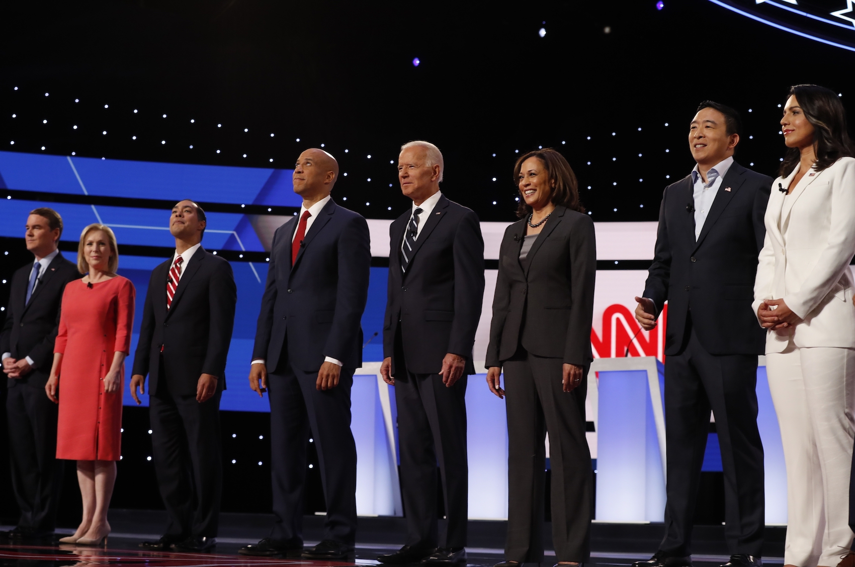 caption: From left, Sen. Michael Bennet, D-Colo., Sen. Kirsten Gillibrand, D-N.Y., former HUD Secretary Julian Castro, Sen. Cory Booker, D-N.J., former Vice President Joe Biden, Sen. Kamala Harris, D-Calif., Andrew Yang and Rep. Tulsi Gabbard, D-Hawaii, are introduced before the second of two Democratic presidential primary debates hosted by CNN Wednesday, July 31, 2019, in the Fox Theatre in Detroit. (Carlos Osorio/AP)