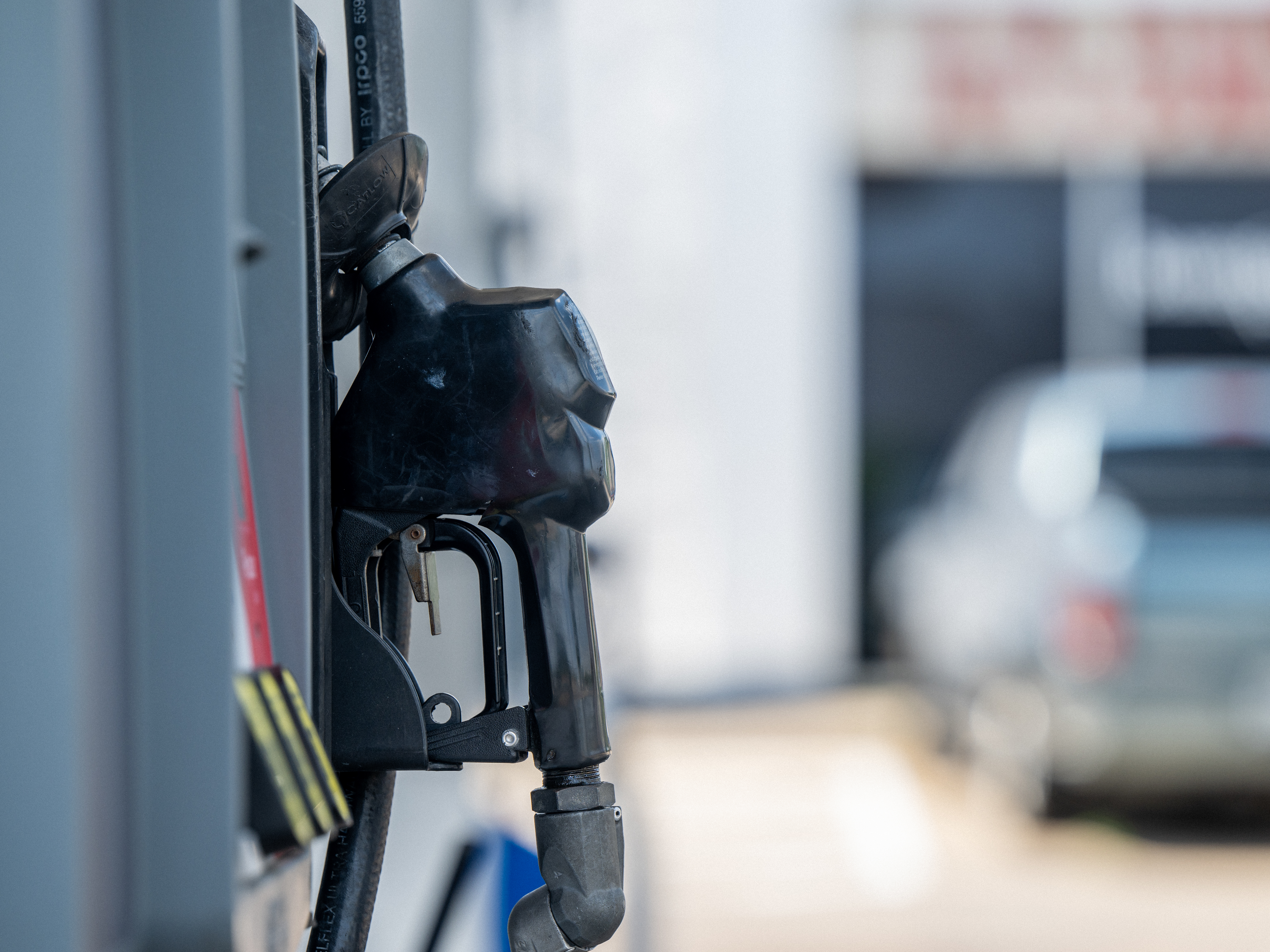 caption: A gas pump is seen at a gas station in Houston on June 9. Gas prices have dropped below $4 a gallon in parts of the country, although the national average remains above that level.