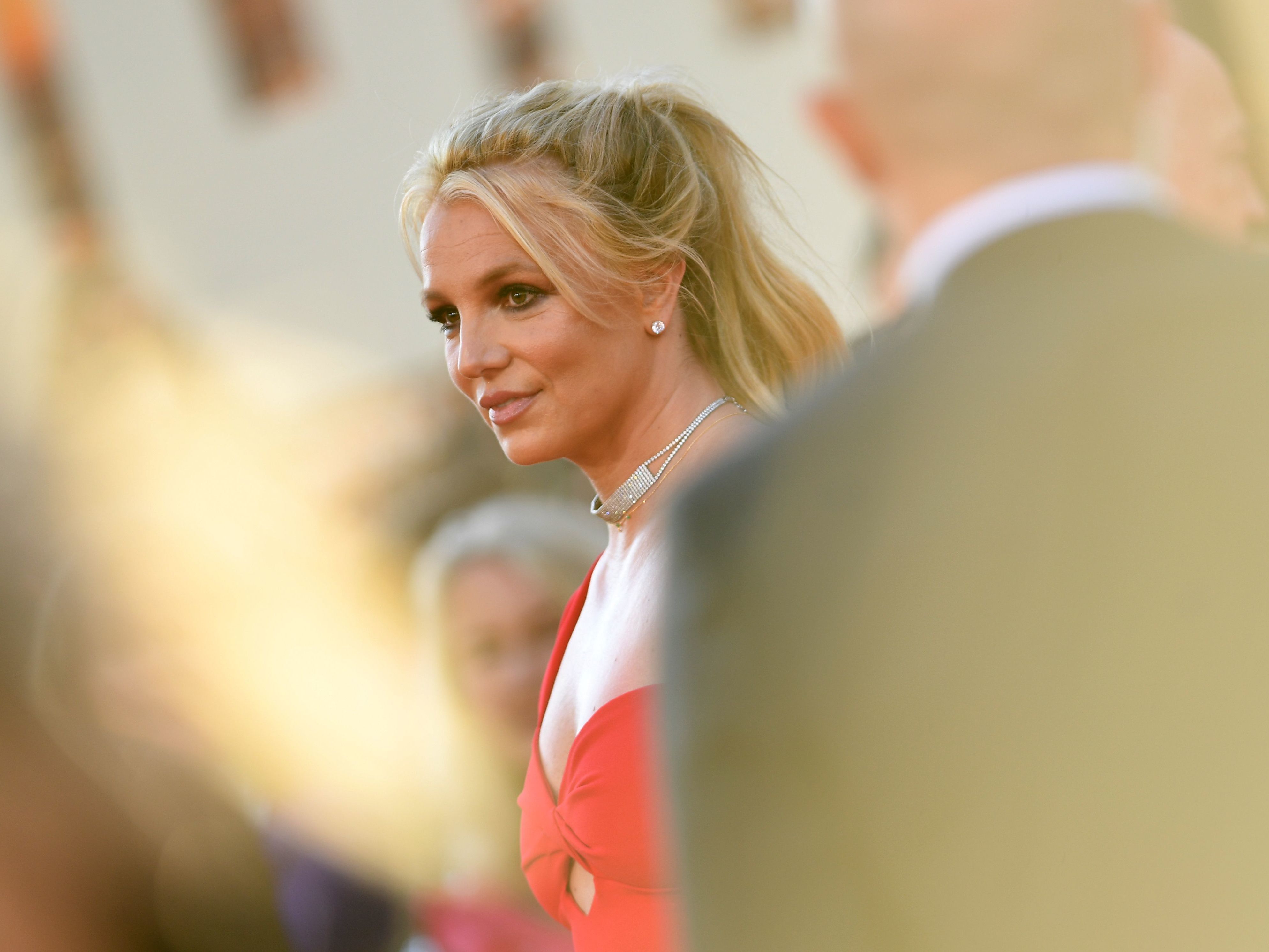 caption: Britney Spears arrives at a movie premiere in Hollywood in 2019.
