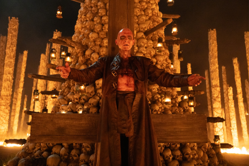 caption: Ralph Fiennes stars as Dr. Kelson in "28 Years Later: The Bone Temple." 