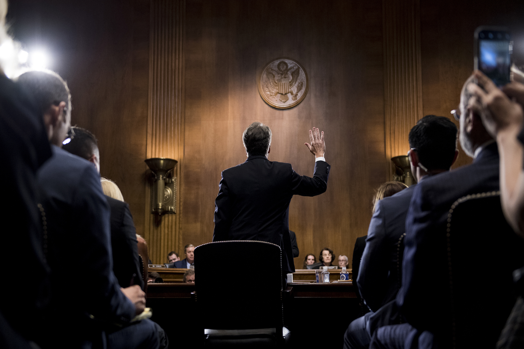 caption: UNITED STATES - SEPTEMBER 27: Judge Brett Kavanaugh is sworn in before testifying during the Senate Judiciary Committee hearing on his nomination be an associate justice of the Supreme Court of the United States, focusing on allegations of sexual assault by Kavanaugh against Christine Blasey Ford in the early 1980s. (Photo By Tom Williams/CQ Roll Call/POOL)