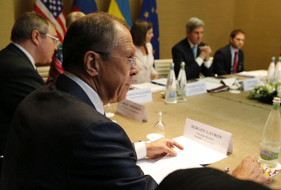 caption: Russian Foreign Minister Sergey Lavrov, left, looks on as U.S. Secretary of State John Kerry, second right, starts a quadrilateral meeting between representatives of the United States, Ukraine, Russia and the European Union about the ongoing situation in Ukraine in Geneva, Switzerland, Thursday.