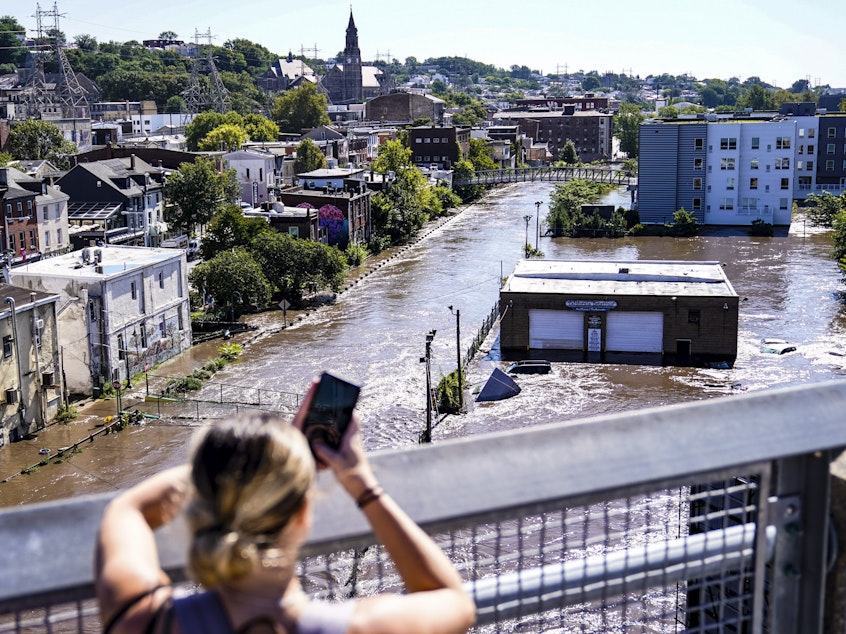 caption: The Schuylkill River floods Philadelphia in the aftermath of Hurricane Ida in September. The extreme rain caught many by surprise, trapping people in basements and cars and killing dozens.