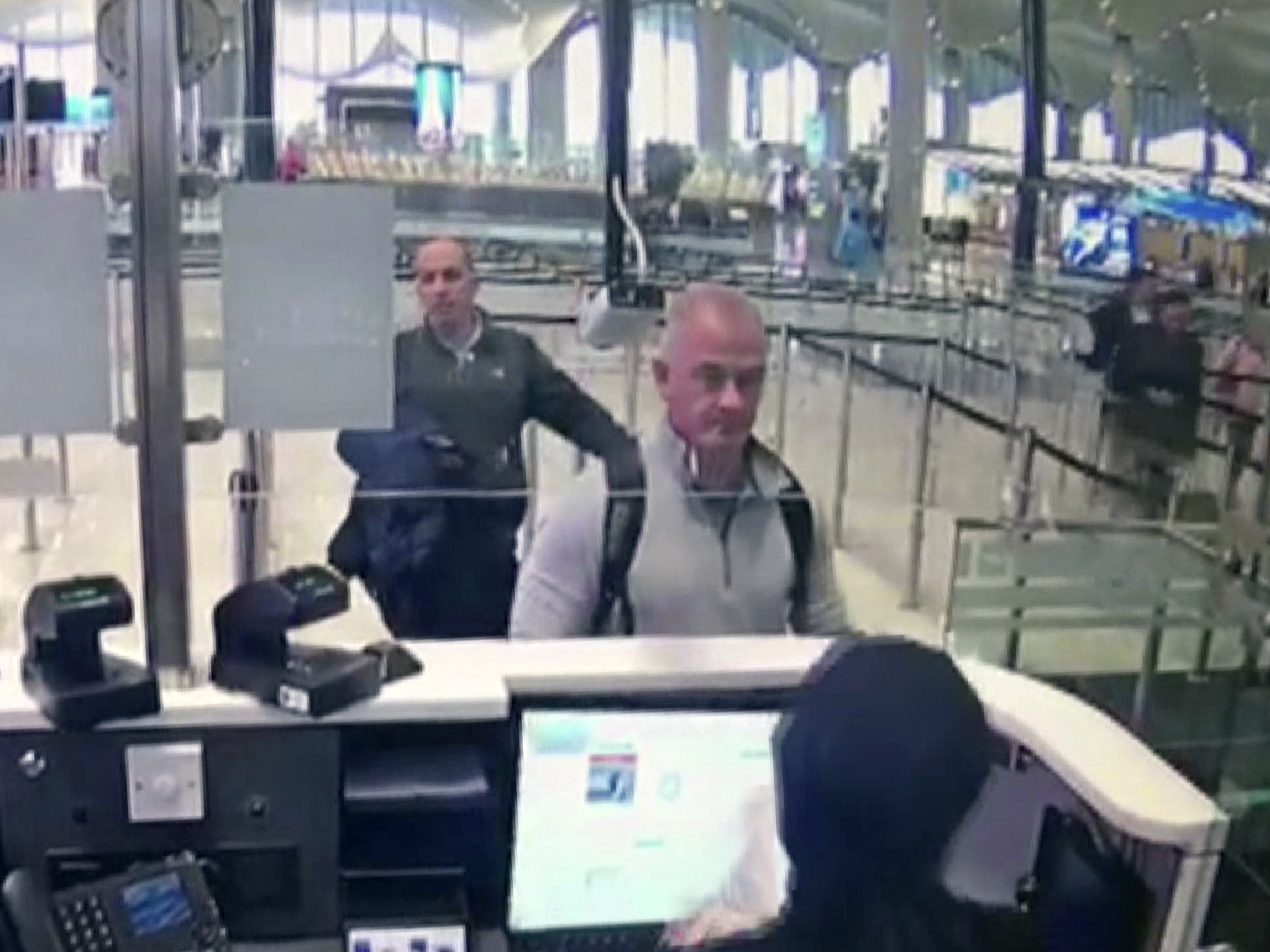 caption: This Dec. 30, 2019 image from security camera video shows Michael L. Taylor, center, and George-Antoine Zayek at passport control at Istanbul Airport in Turkey. Taylor and his son Peter, are charged in Japan with helping Nissan's former chairman, Carlos Ghosn, jump bail and escape Japan for Lebanon.
