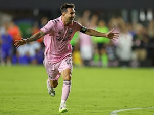 caption: Lionel Messi celebrates the game-winning goal after defeating Cruz Azul on Friday.